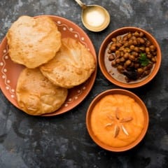 N2 Poori and Halwa or chole.